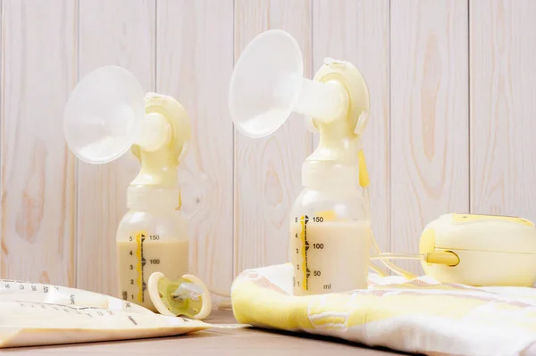 Double Breast Pump Milk Baby Bottle Wood Background — Stock Photo, Image