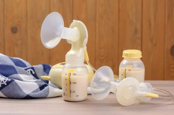 Double Breast Pump Milk Baby Bottle Wood Background — Stock Photo, Image