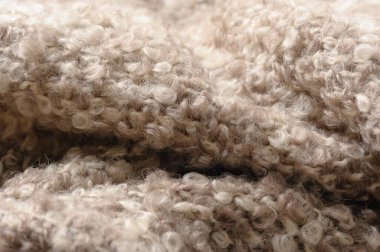 Örgü kumaş battaniyesinin soyut dokusu, soyut kumaş arkaplanı, biege mohair dokusu