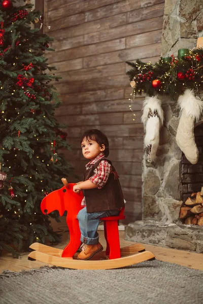 amazed toddler on rocking moose