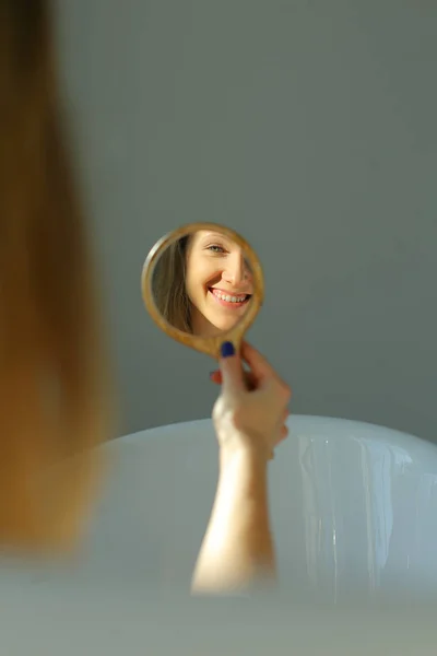 Happy woman in mirror — Stock Photo, Image