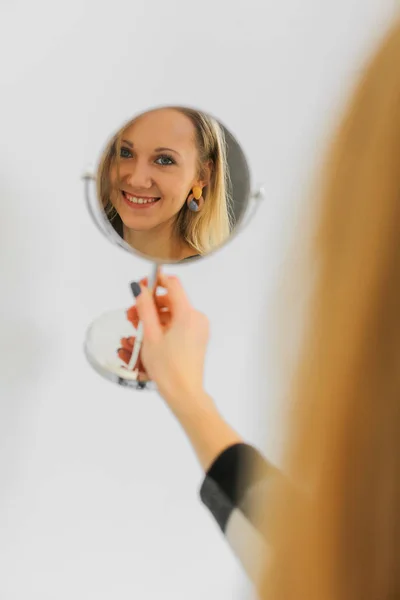 Reflection of young woman — Stock Photo, Image