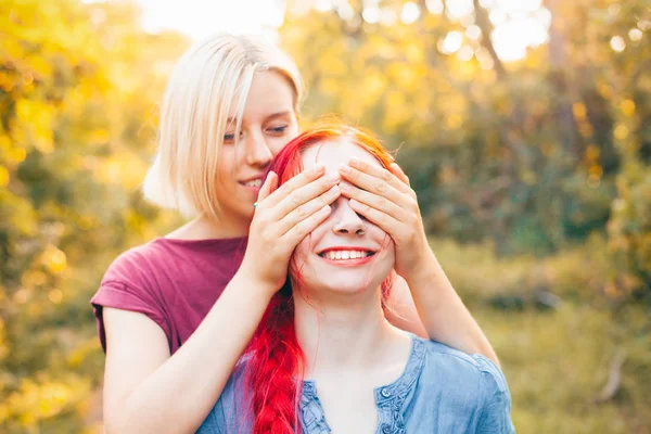 Cheerful Young Woman Covers Eyes Another Woman Best Friends — Stock Photo, Image