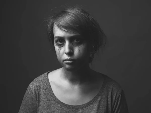 Tearful young woman. Black and white portrait
