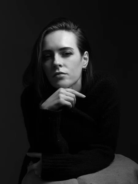 Portrait of the adorable woman in studio. Black and white.