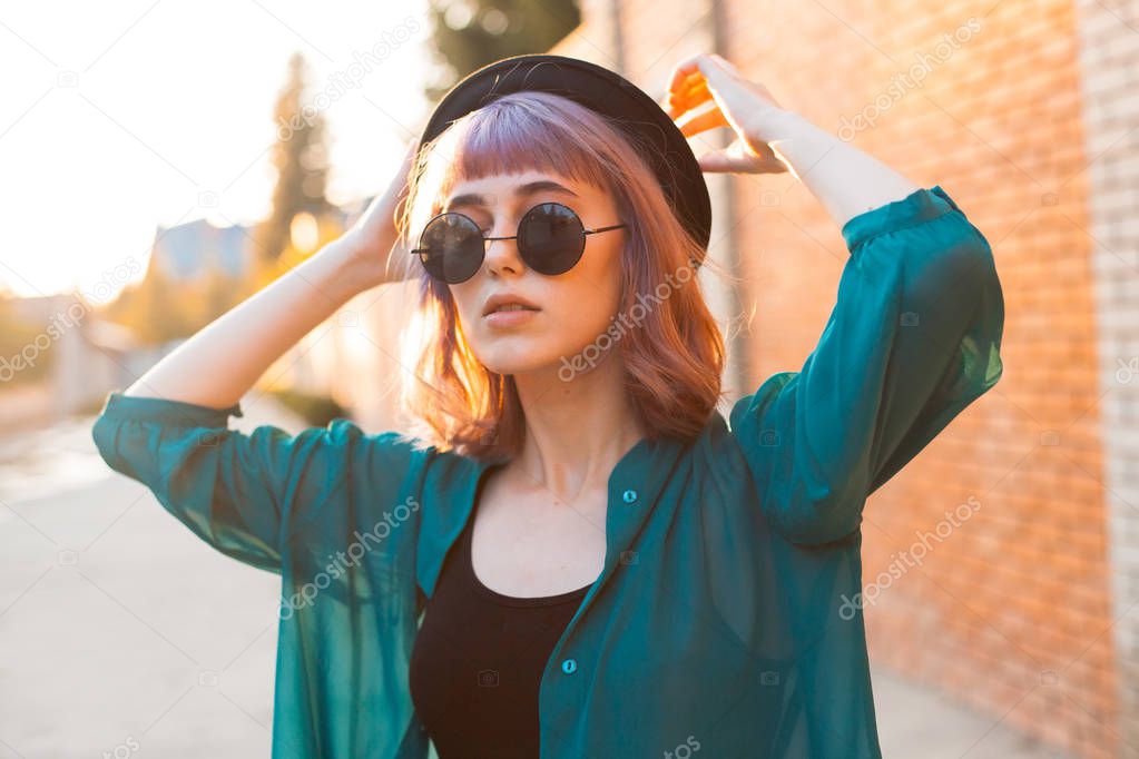 Stylish young woman walking in the city.