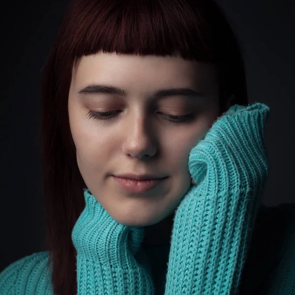 Portrait of calm woman in studio. Close up.