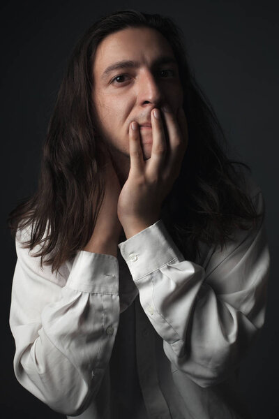Portrait of a worried young man. Studio