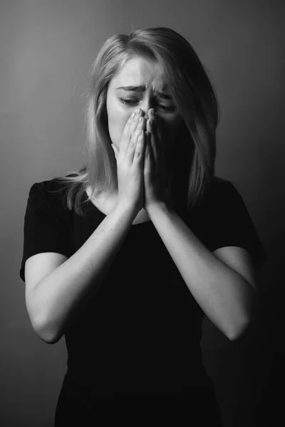 Portrait of crying young woman. Black and white