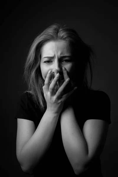 Portrait of crying young woman. Black and white