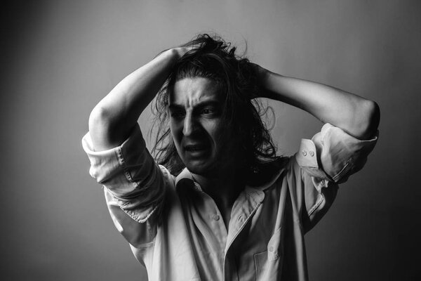 Despair. Portrait of young man. Black and white.