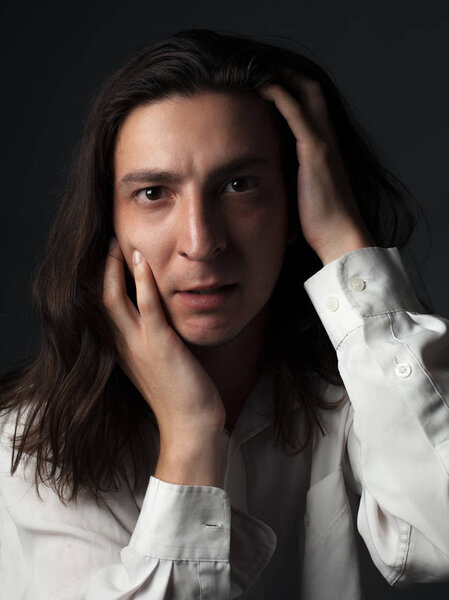 Portrait of a worried young man. Studio