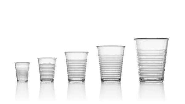 Set Five Increasing Size Empty Transparent Plastic Cups Isolated White — Stock Photo, Image