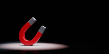 Red Magnet Spotlighted on Black Background clipart