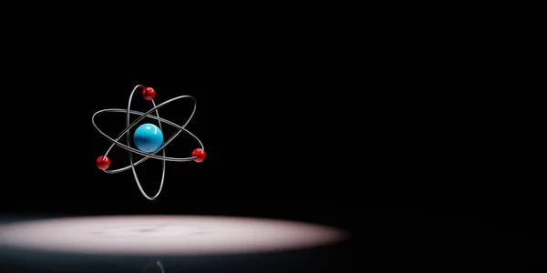 Símbolo de átomo destacado no fundo preto — Fotografia de Stock
