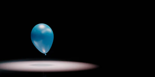 Ballon bleu mis en lumière sur fond noir — Photo