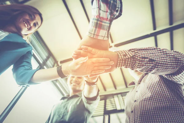 business people joined hand at meeting desk