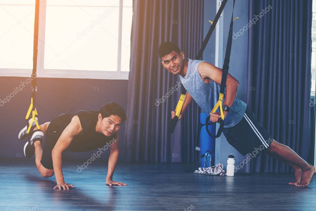 workout concept; young people practicing workout in class 