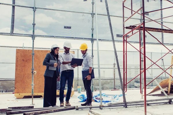 Project engineer, engineer and technician working on construction site, construction site engineer working on and inspect blueprint of project