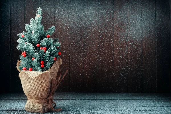 Small Christmas Tree Packed Burlap Dark Snowy Background — Stock Photo, Image