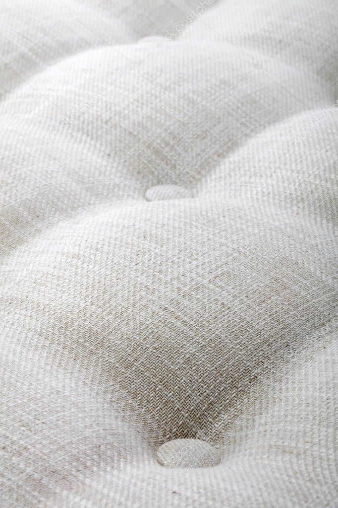 close up of white texture of mattress, bedding pattern background