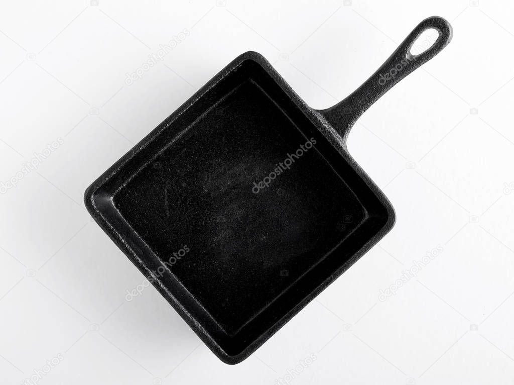 Elevated view of black pan isolated on white background