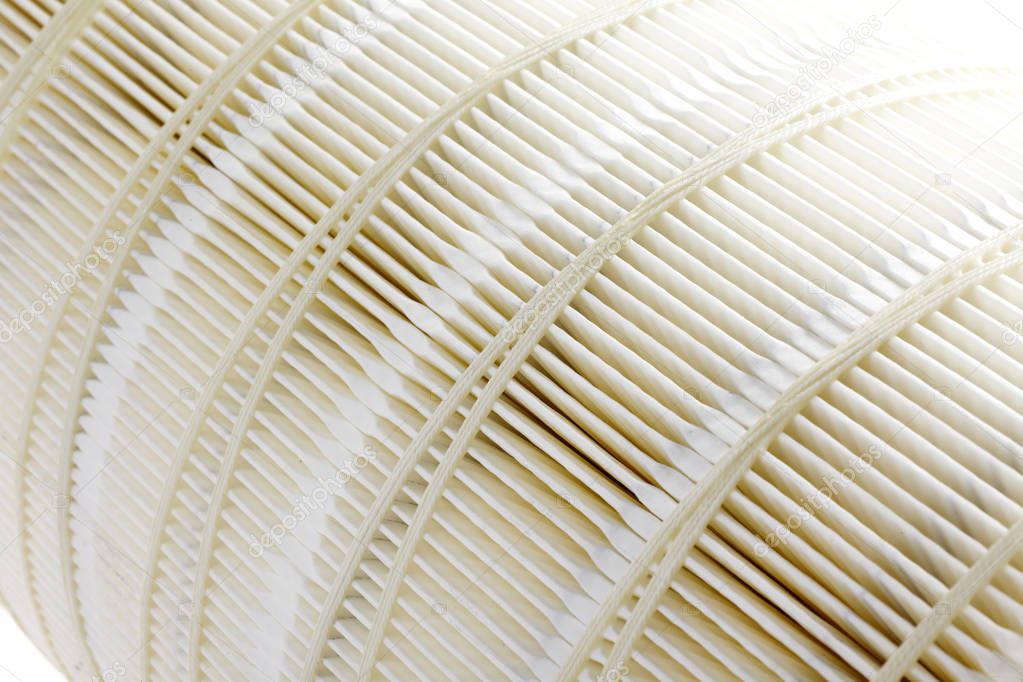 Closeup of car air filter isolated on white background