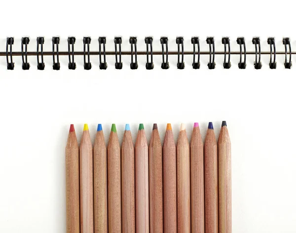 Closeup Colorful Pencils White Copybook Background — Stock Photo, Image