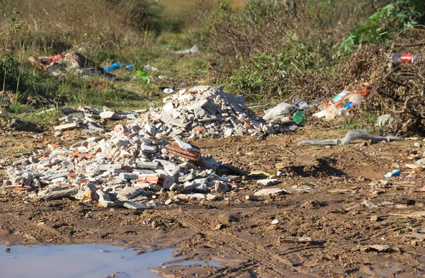 landfill with human waste that contaminates the environment
