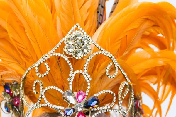 detail of bright stones and carnival feathers