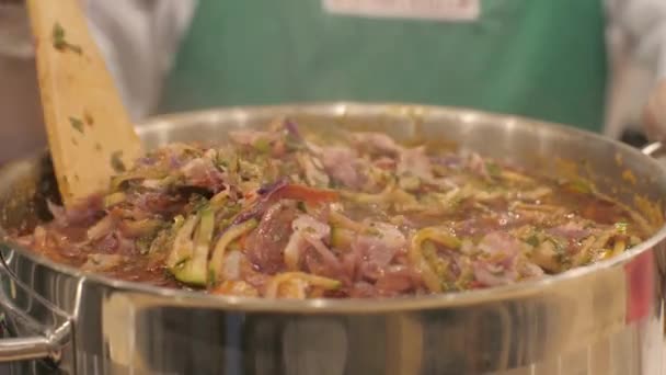 Chef cook mixing meat soup during boiling in pot on kitchen close up — Stock Footage Chef cook mixing meat soup during boiling in pot on kitchen close up Royalty Free Stock Footage
