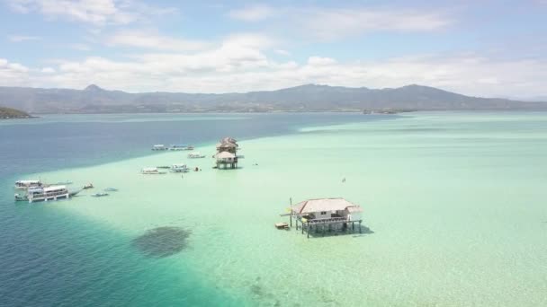 Tranquil beach resort in the ocean with pristine turqouise blue clear water. — Stock Video