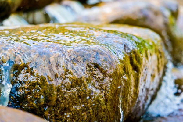 Fresh water flow through the stone on morning time