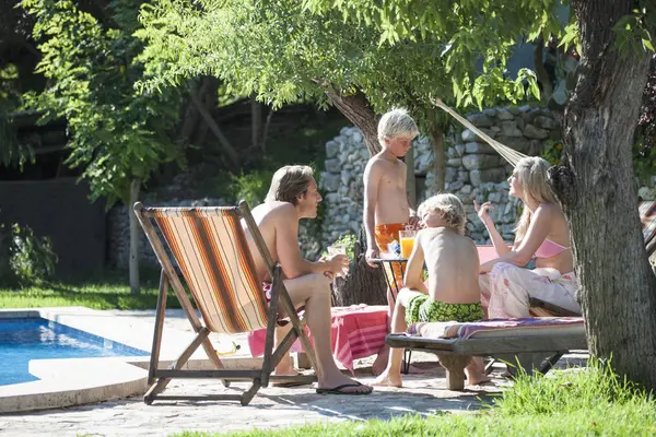 Family Relaxing Outdoor Swimming Pool — Stock Photo, Image