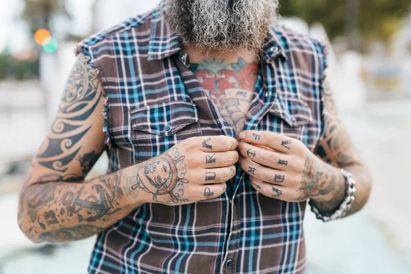 Tattooed Male Hipster Fastening Shirt Buttons Cropped — Stock Photo, Image