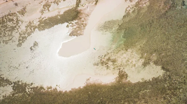 aerial photography of the Indian Ocean coastline. Burmese gather oysters in shallow waters.