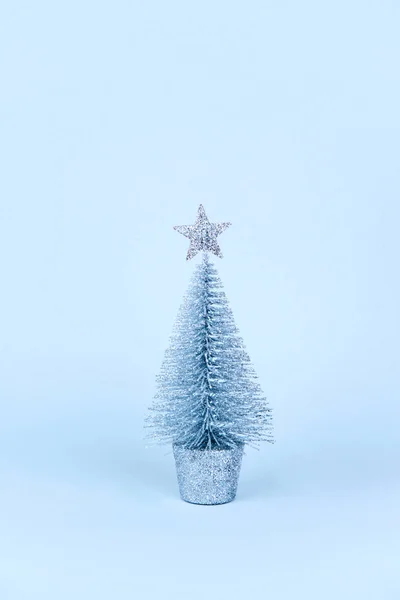 Christmas tree over light blue background. — Stock Photo, Image