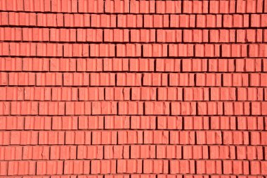 Arka plan olarak kırmızı taş bloklar closeup tuğla duvar dokusu. Yıl 2019 rengini.