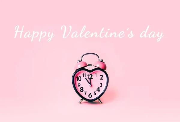 Heart shaped clock on pink background. — Stock Photo, Image