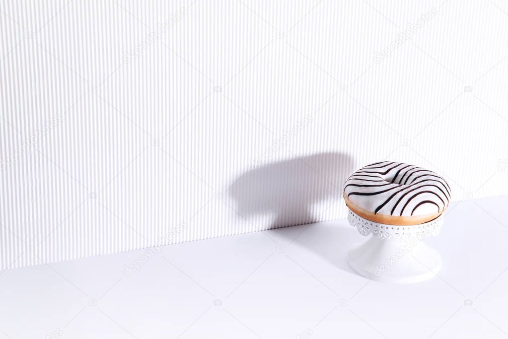 Striped donut on a white background.