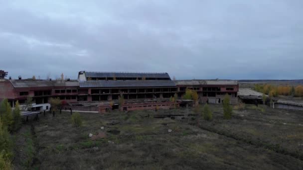 Old abandoned airport building in front of cold dark blue sky — Stock Video