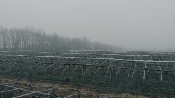 Aerial view on the old large greenhouse. — Stock Video