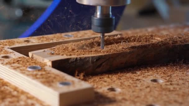 Automatic milling cutting wood machine. drill holes for the pieces of wood. Closeup. — Stock Video