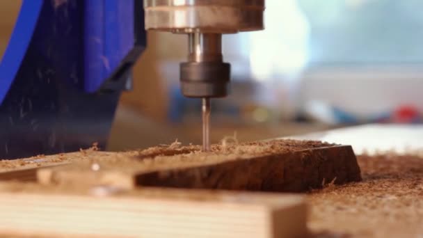 Automatic milling cutting wood machine. drill holes for the pieces of wood. Closeup. — Stock Video