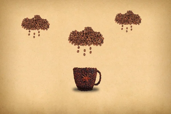 Creative concept photo of a cup of coffee and cloud with rain made of coffee beans.