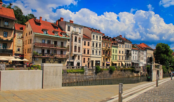LJUBLJANA, SLOVENIA - JUNE 28, 2014: Old town embankment in Ljubljana. Ljubljana is the business and cultural center of the country.