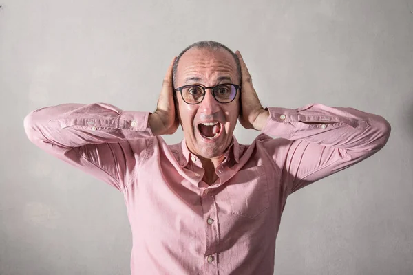 a Stressed man with hands in head