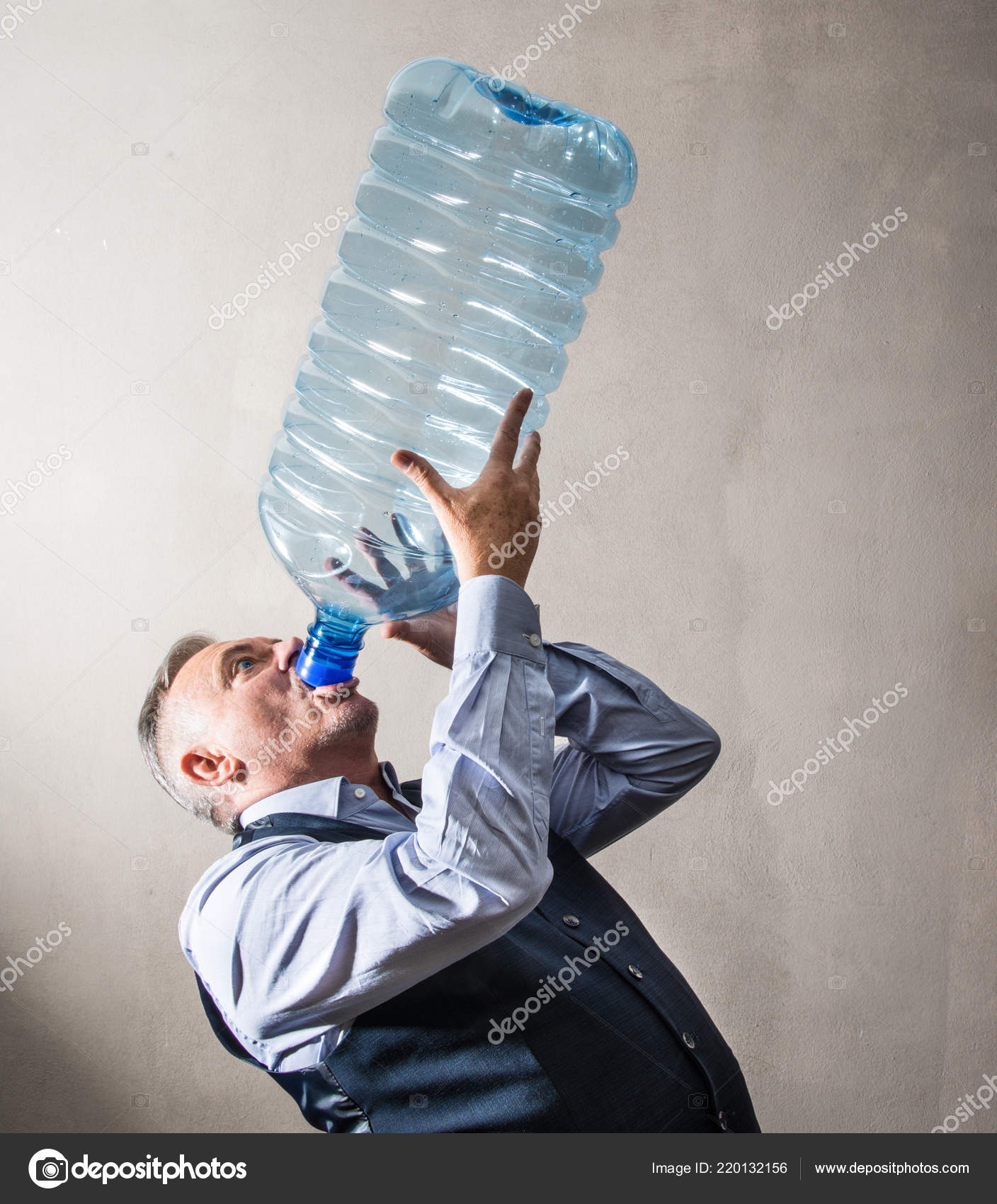 Man Giant Water Bottle Stock Photo by ©Photobeps 220132156