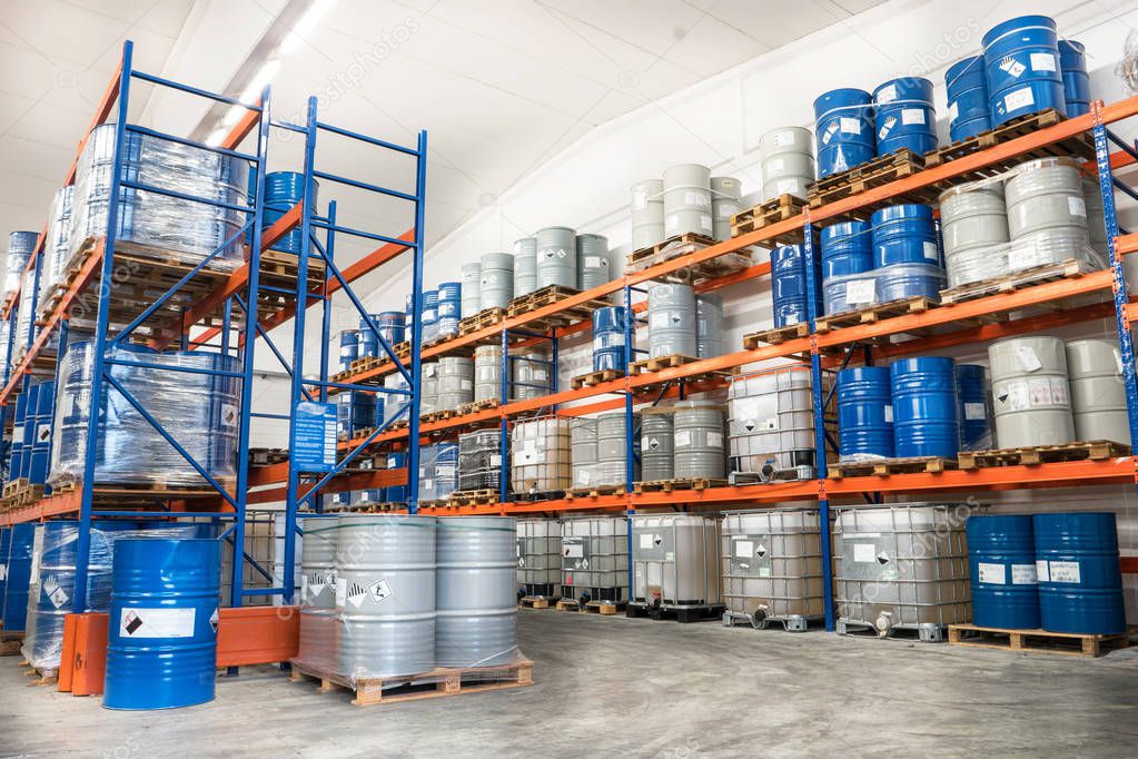 many Metal drums stored in warehouse