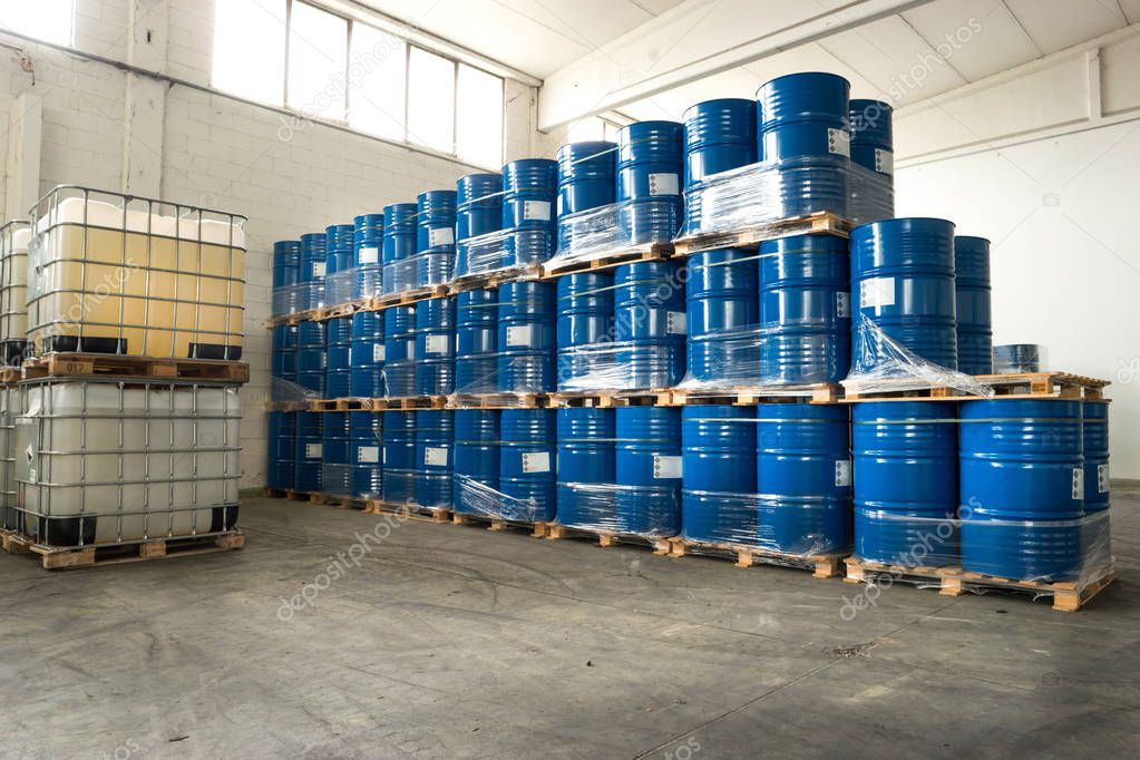 many Metal drums stored in warehouse